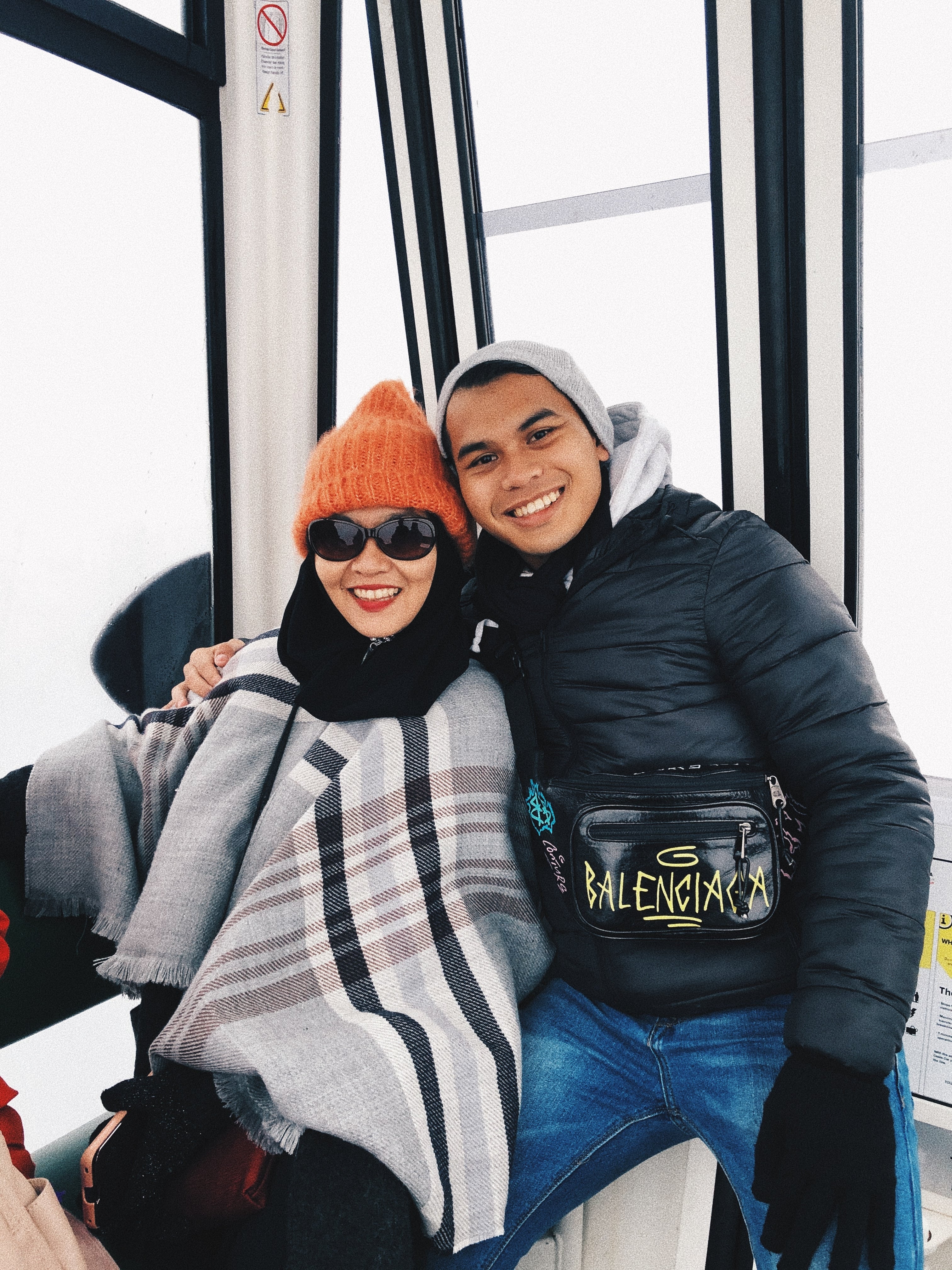 Hida Aldric sharing a moment with a family member while travelling