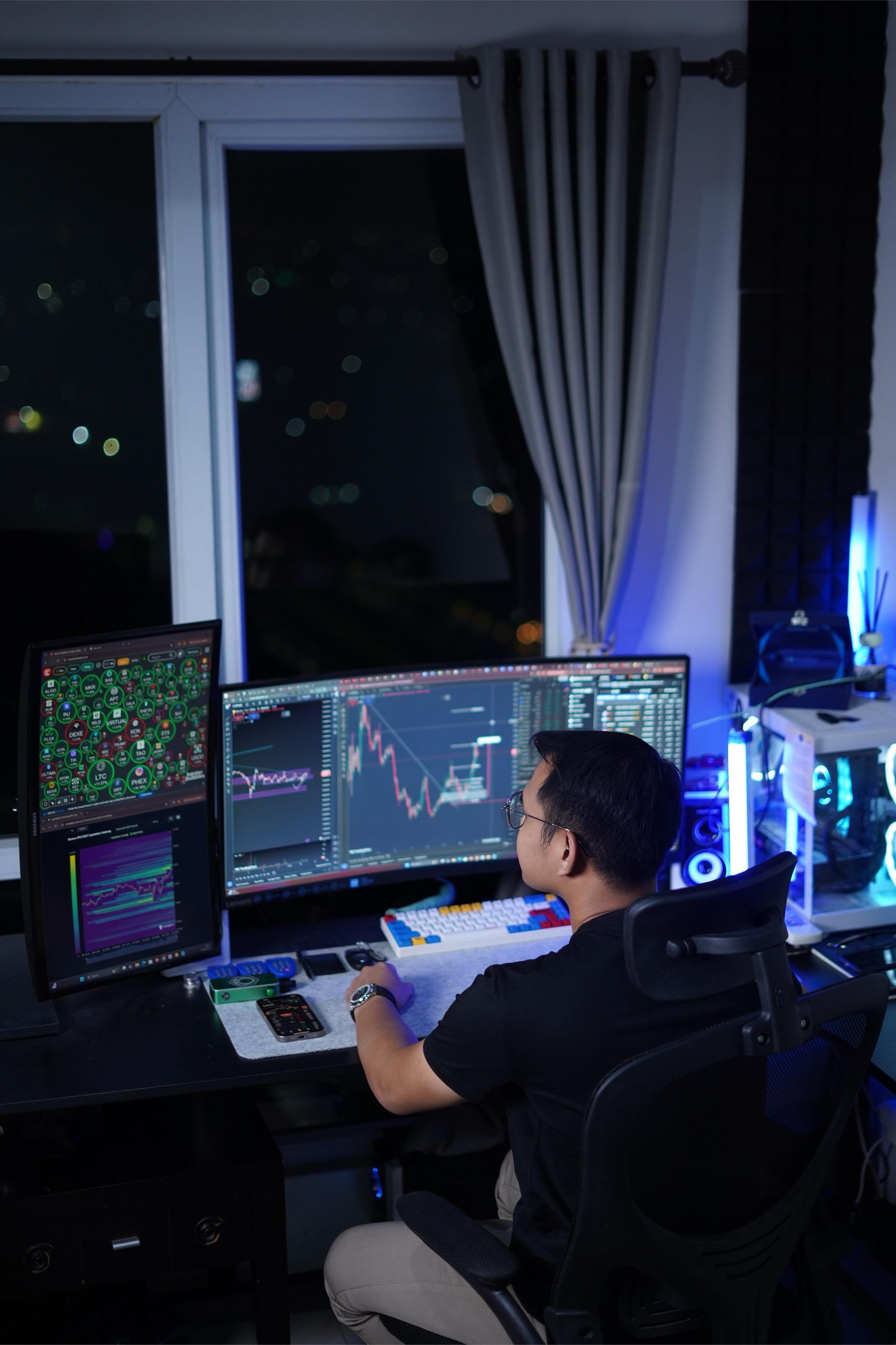 Hida Aldric researching financial markets at his desk